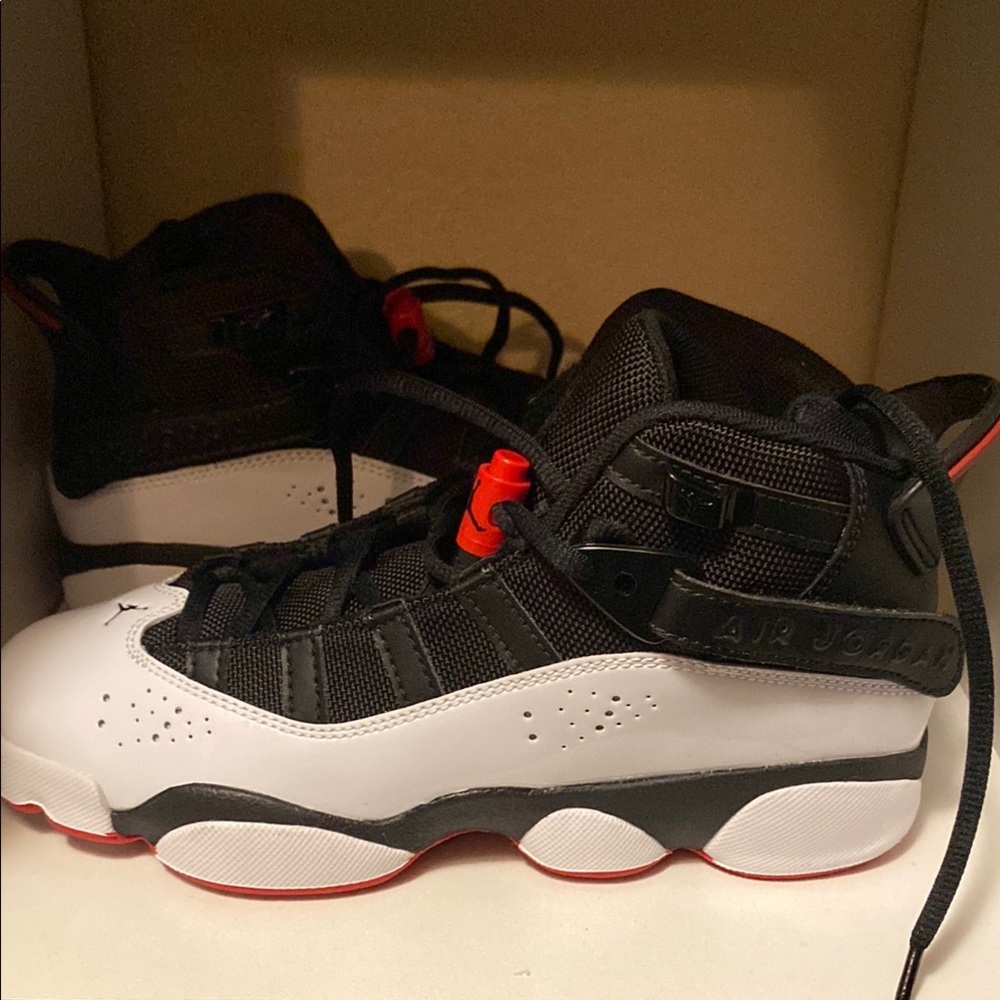 Black and White Sneakers with Red Accents